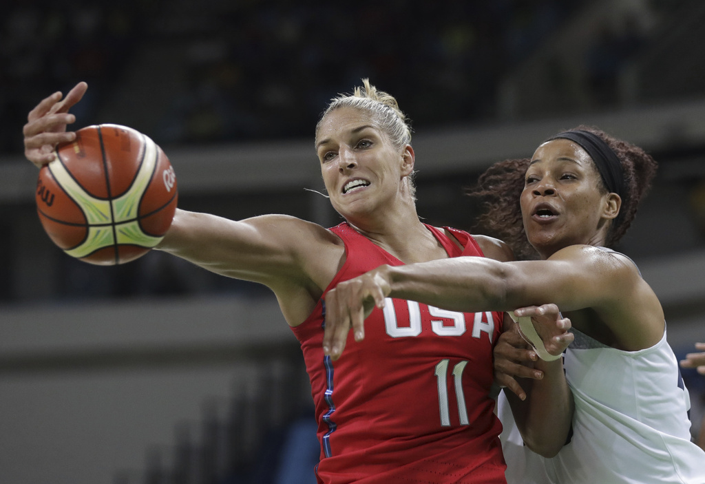 File - This Aug. 18, 2016, file photo shows United States' Elena Delle Donne (11) and France's Marielle Amant, right, reaching out for the ball during a women's semifinal round basketball game at the 2016 Summer Olympics in Rio de Janeiro, Brazil. (AP Photo/Eric Gay, File)