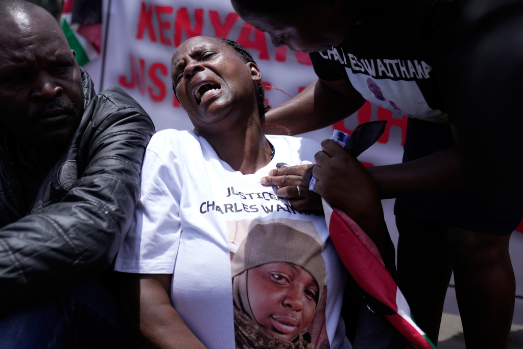 A woman whose relative joined the Russian army to fight in Ukraine weeps during a protest calling for their repatriation in Nairobi, Kenya, Thursday, March 5, 2026. (AP Photo/Brian Inganga)