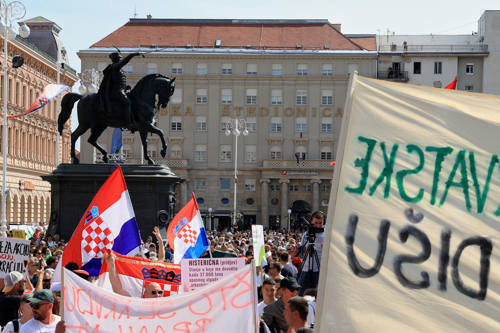 Thousands of people rally in protest over the discovery of illegally imported and disposed waste, including hazardous and toxic materials, in downtown Zagreb, Croatia, Saturday, Sept. 5, 2026. (AP Photo)