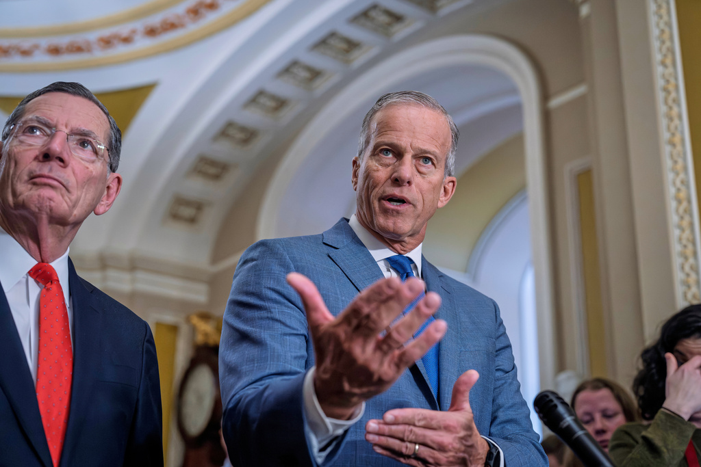 Senate Majority Leader John Thune, R-S.D., joined at left by Sen. John Barrasso, R-Wyo., the GOP whip, reflects on President Donald Trump's State of the Union address as he meets with reporters at the Capitol in Washington, Wednesday, Feb. 25, 2026. (AP Photo/J. Scott Applewhite)