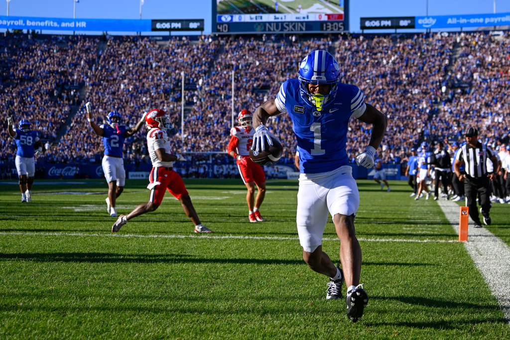 BYU wide receiver Legend Glasker (1) runs to a touchdown in the first half during an NCAA college football game against Utah Tech Saturday, Sept. 5, 2026 in Provo, Utah. (AP Photo/Alex Goodlett)