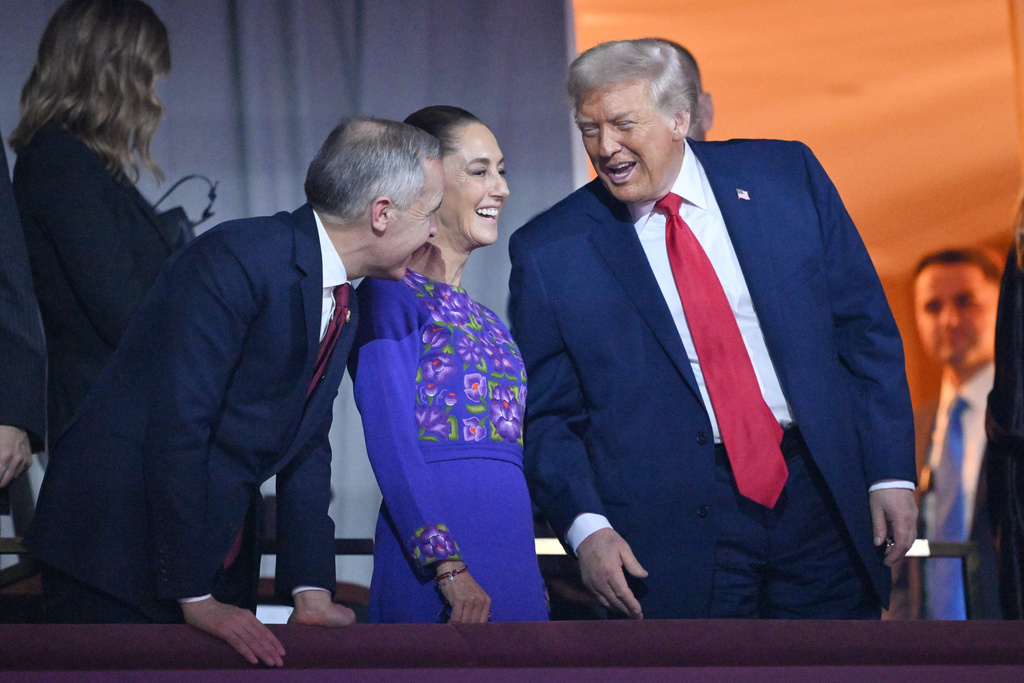 President Donald Trump speaks with Canadian Prime Minister Mark Carney and Mexican President Claudia Sheinbaum after the draw for the 2026 soccer World Cup at the Kennedy Center in Washington, Friday, Dec. 5, 2025. (Mandel Ngan/Pool Photo via AP)