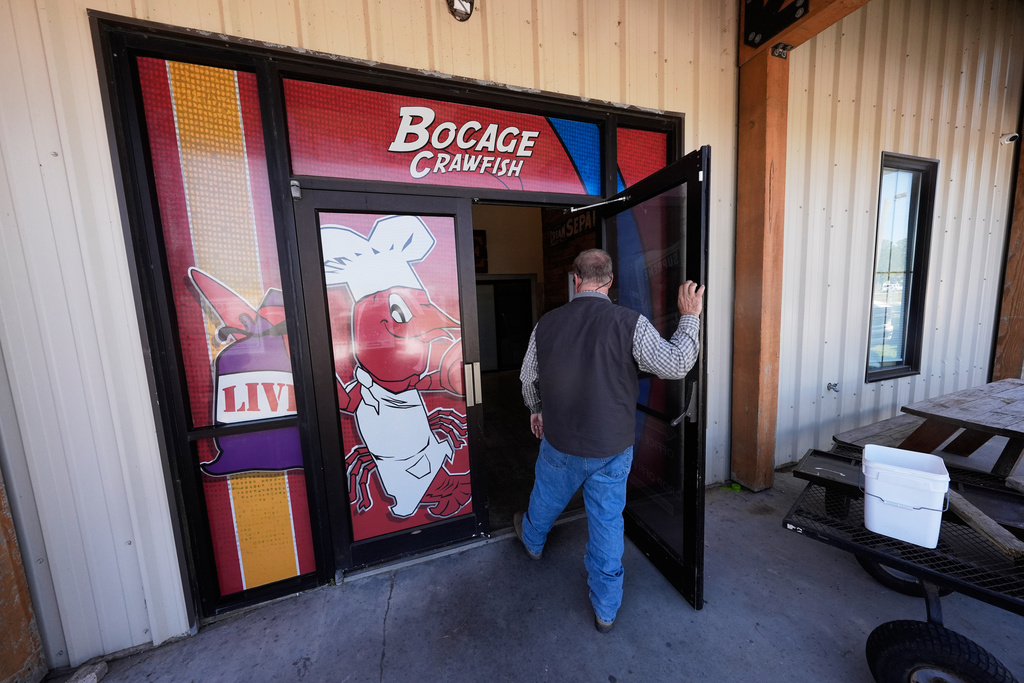 Alan Lawson enters the Bocage Crawfish processing facility in Crowley, La., Thursday, March 19, 2026. (AP Photo/Gerald Herbert)