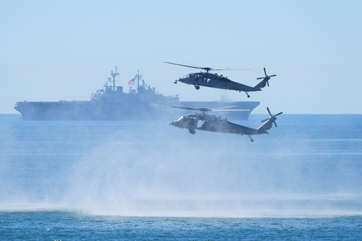 Marines perform a demonstration with helicopters and the amphibious assault ship USS Boxer as Vice President JD Vance, not pictured, watches to mark the upcoming Marine Corps' 250th anniversary Saturday, Oct 18, 2025, on Marine Corps Base Camp Pendleton in Camp Pendleton, Calif. (AP Photo/Gregory Bull) Marines perform a demonstration with helicopters and the amphibious assault ship USS Boxer as Vice President JD Vance, not pictured, watches to mark the upcoming Marine Corps' 250th anniversary Saturday, Oct 18, 2025, on Marine Corps Base Camp Pendleton in Camp Pendleton, Calif. (AP Photo/Gregory Bull)