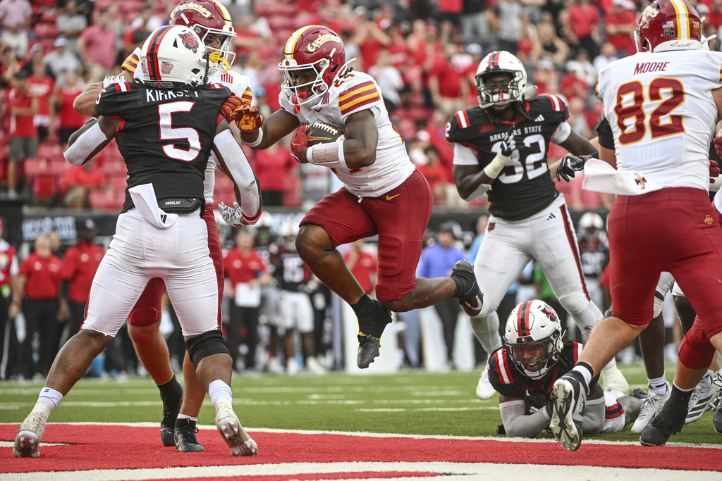 Iowa State running back Abu Sama III (24) finds a hole in the Arkansas State defense as he scores a touchdown during an NCAA college football game Saturday, Sept. 13, 2025, in Jonesboro, Ark. (AP Photo/Michael Woods)