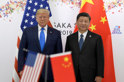 FILE - President Donald Trump, left, poses for a photo with Chinese President Xi Jinping during a meeting on the sidelines of the G-20 summit in Osaka, Japan, June 29, 2019. (AP Photo/Susan Walsh, File) FILE - President Donald Trump, left, poses for a photo with Chinese President Xi Jinping during a meeting on the sidelines of the G-20 summit in Osaka, Japan, June 29, 2019. (AP Photo/Susan Walsh, File)