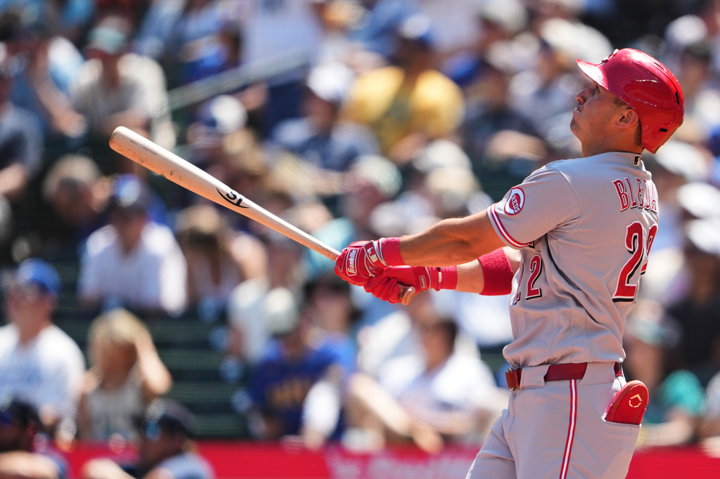 Cincinnati Reds' JJ Bleday follows through on a solo home run against the Seattle Mariners during the fourth inning of a baseball game, Wednesday, July 22, 2026, in Seattle. (AP Photo/Lindsey Wasson)