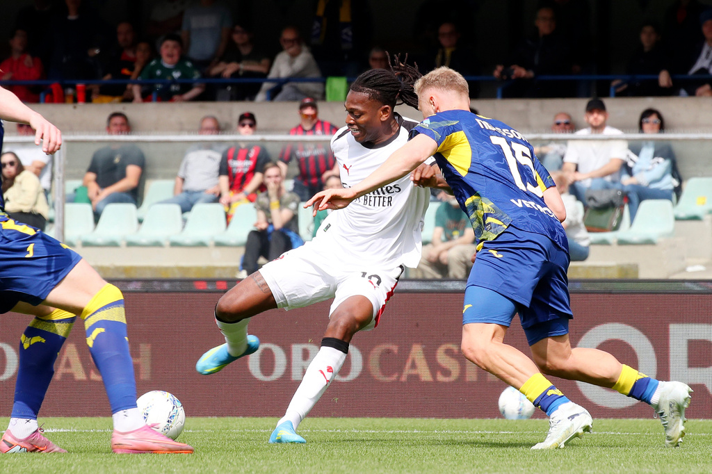 AC Milan's Rafael Leao and Verona's Victor Nelsson, right, in action during the Serie A soccer match between Hellas Verona and A.C. Milan in Verona, Italy, Sunday April 19, 2026. (Paola Garbuio/LaPresse via AP)