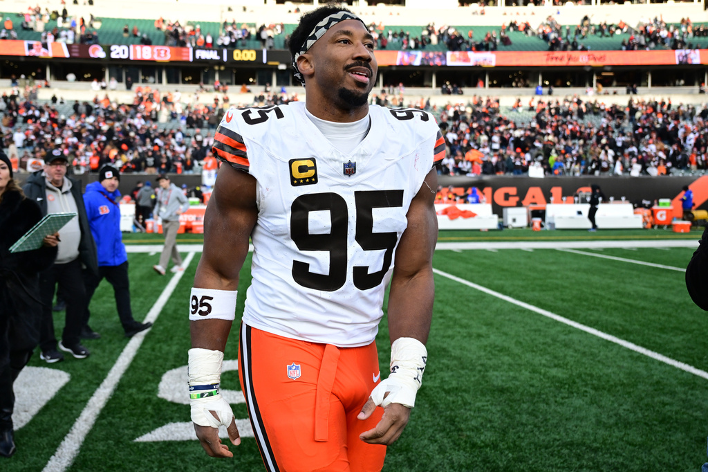FILE - Cleveland Browns defensive end Myles Garrett celebrates with fans after an NFL football game against the Cincinnati Bengals in Cincinnati, Jan. 4, 2026. (AP Photo/David Dermer, File)