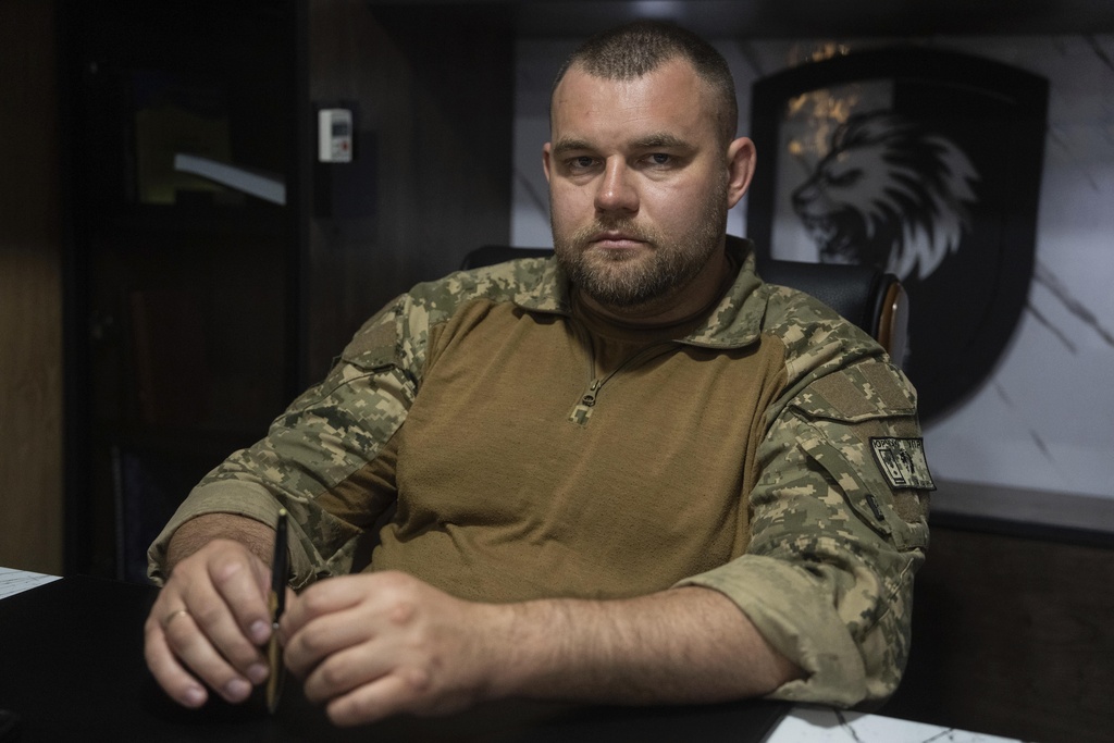 Pavlo Yurchuk, commander of the 63rd Mechanized Brigade, poses for a portrait in his cabinet in Donetsk region, Ukraine, Thursday, Sept.11, 2025. (AP Photo/Alex Babenko)