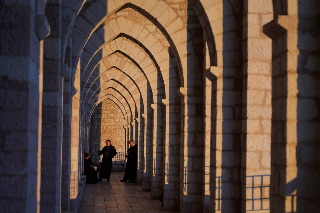 Friars gather at the monastery of the St. Francis Basilica in Assisi, Italy, Saturday, Feb. 21, 2026, on the eve of a public exposition of the saint remains to mark the 800th anniversary of his death in 1226. (AP Photo/Gregorio Borgia)