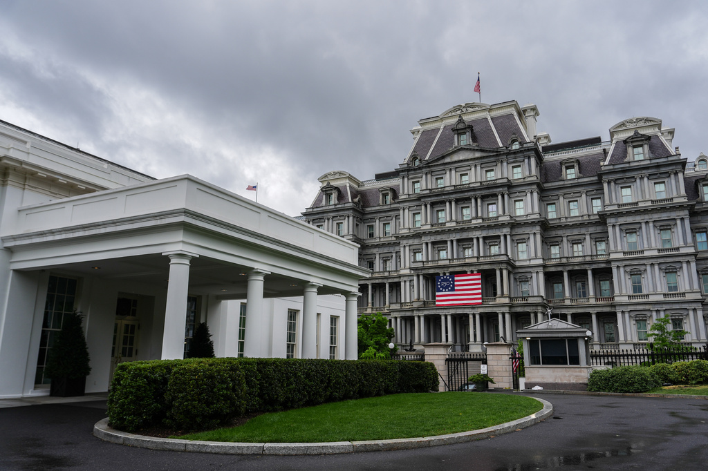 An America 250 flag is seen on the Eisenhower Executive Office Building, past the West Wing of the White House, Sunday, April 19, 2026, in Washington. (AP Photo/Julia Demaree Nikhinson)