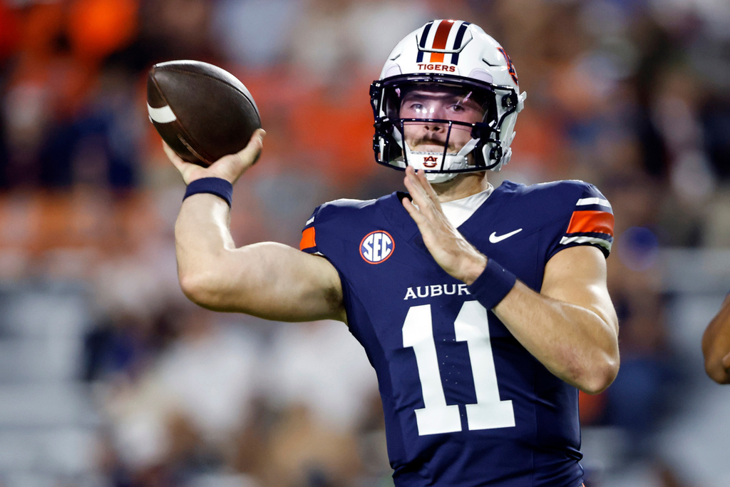 Auburn quarterback Jackson Arnold warms up before an NCAA college football game against Missouri, Saturday, Oct. 18, 2025, in Auburn, Ala. (AP Photo/Butch Dill)