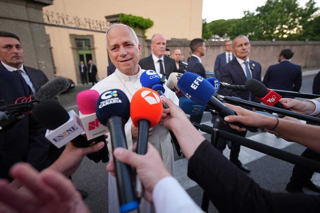 Pope Leo XIV talks to journalists as he leaves his residence in Castel Gandolfo, on the outskirts of Rome, to return to the Vatican, Tuesday, June 16, 2026. (AP Photo/Andrew Medichini)