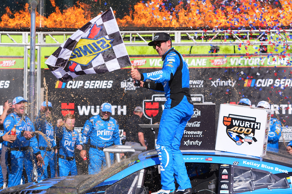 Chase Elliott, center, celebrates after winning a NASCAR Cup Series auto race in Fort Worth, Texas, Sunday, May 3, 2026. (AP Photo/LM Otero)
