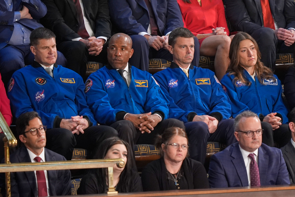 Astronauts for the upcoming Artemis II mission listen as President Donald Trump delivers the State of the Union address to a joint session of Congress in the House chamber at the U.S. Capitol in Washington, Tuesday, Feb. 24, 2026. (AP Photo/Mark Schiefelbein)