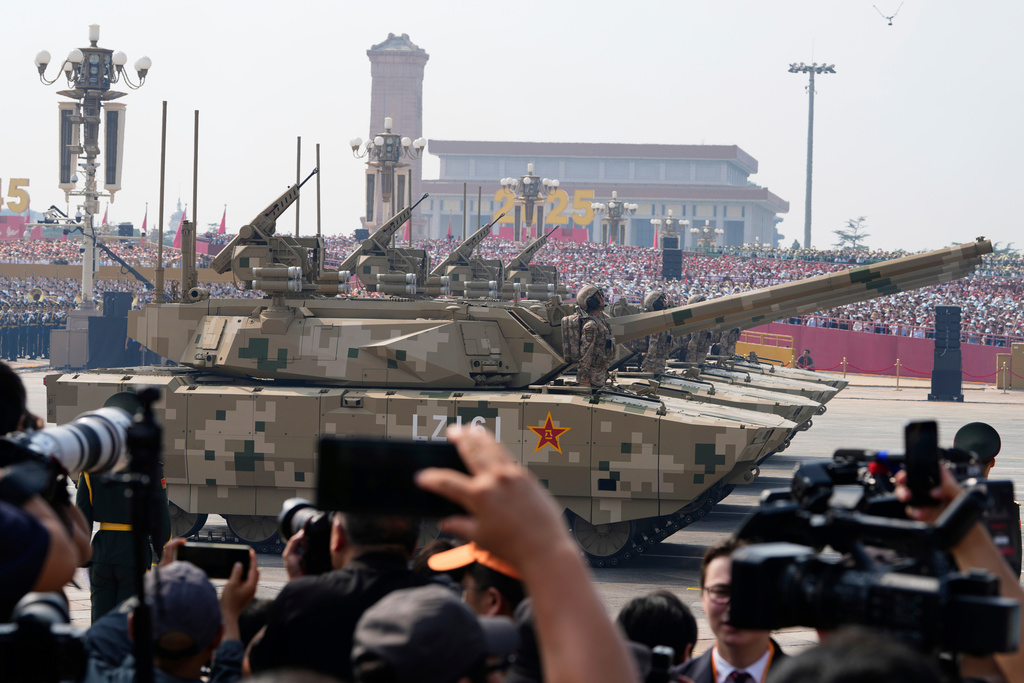FILE - Armoured vehicles take part in a military parade to commemorate the 80th anniversary of Japan's World War II surrender held in front of Tiananmen Gate in Beijing, Wednesday, Sept. 3, 2025. (AP Photo/Ng Han Guan, File)