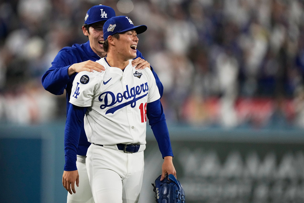 Los Angeles Dodgers pitcher Yoshinobu Yamamoto celebrates their win against the Toronto Blue Jays during the 18th inning in Game 3 of baseball's World Series, Monday, Oct. 27, 2025, in Los Angeles. (AP Photo/Brynn Anderson)