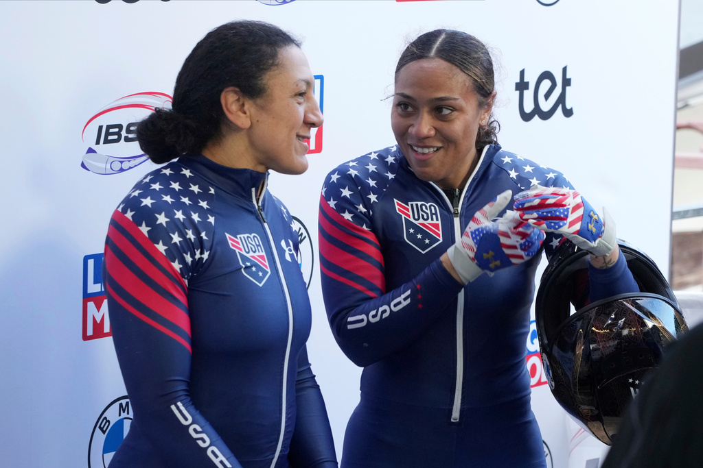 FILE - Fifth placed Elana Meyers Taylor and Azaria Hill of USA react after their second run of the two-woman Bobsleigh World Cup race in Sigulda, Latvia, Sunday, Feb. 4, 2024. (AP Photo/Oksana Dzadan, File)