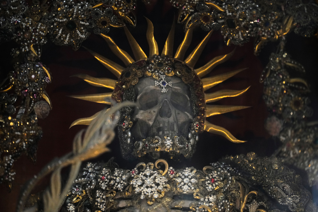 An elaborately decorated skeleton stands in the catholic monastery church of Banz in Bad Staffelstein, Germany, Saturday, May 2, 2026. (AP Photo/Matthias Schrader)
