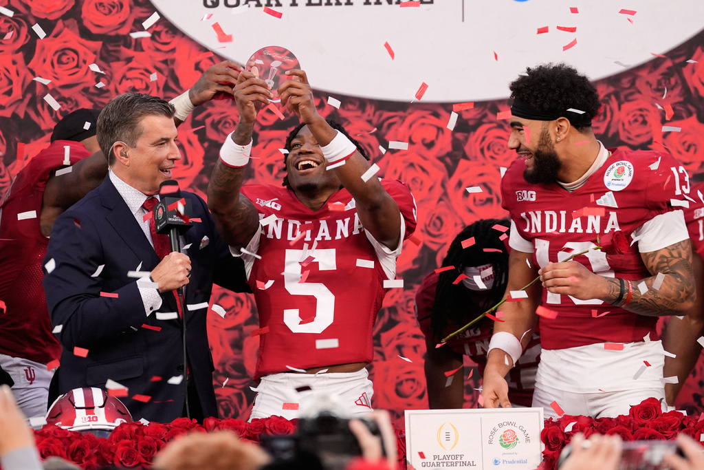 Indiana defensive back D'Angelo Ponds (5) lift the defensive MVP trophy after a win over Alabama in the Rose Bowl College Football Playoff quarterfinal game Thursday, Jan. 1, 2026, in Pasadena, Calif. (AP Photo/Mark J. Terrill)