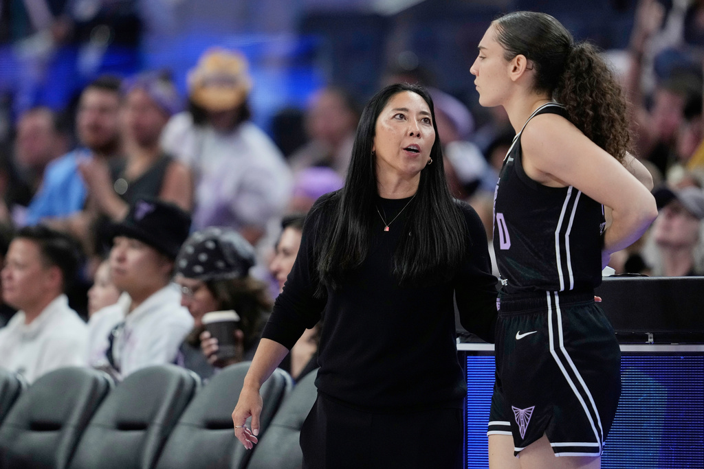 Golden State Valkyries head coach Natalie Nakase, left, speaks to guard Carla Leite, right, during the second half of a WNBA basketball game against the Indiana Fever, Sunday, Aug. 31, 2025, in San Francisco. (AP Photo/Godofredo A. Vásquez)
