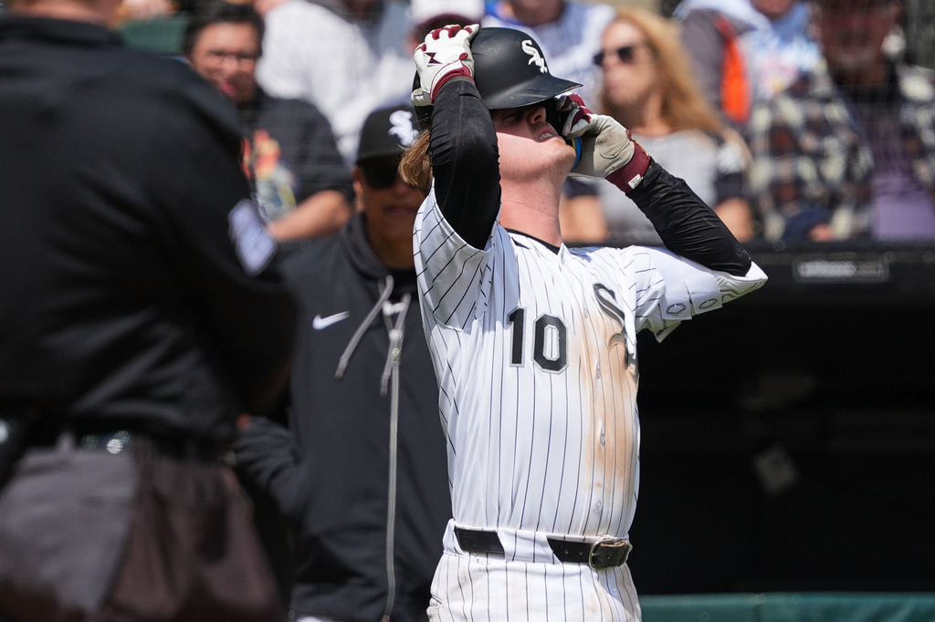Chicago White Sox's Chase Meidroth puts on his helmet after an injury during the third inning of a baseball game against the Washington Nationals at Rate Field in Chicago, Sunday, April 26, 2026. (AP Photo/Nam Y. Huh)