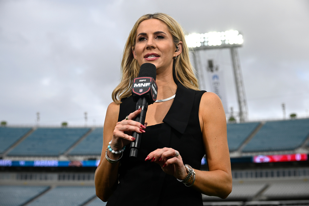 FILE - ESPN Monday Night Football sideline reporter Laura Rutledge broadcasts from the sideline before an NFL football game between the Jacksonville Jaguars and the Kansas City Chiefs, Monday, Oct. 6, 2025, in Jacksonville, Fla. (AP Photo/Phelan M. Ebenhack, File)