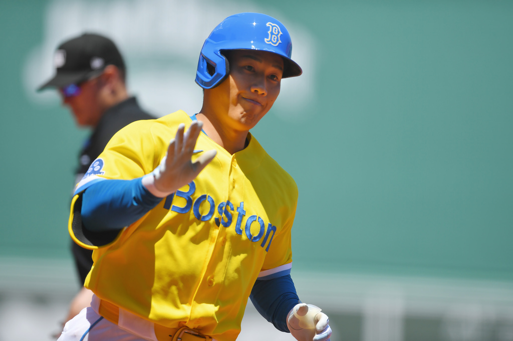 Boston Red Sox's Masataka Yoshida celebrates as he crosses home plate to score on his home run in the first inning of a baseball game against the New York Yankees, Saturday, June 27, 2026, in Boston. (AP Photo/Steven Senne)