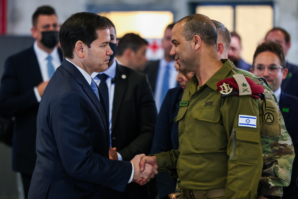 US Secretary of State Marco Rubio speaks with Israeli Brigadier General Yaakov Dolf as he visits the Civil-Military Coordination Center in Southern Israel, Friday, Oct. 24, 2025. (Fadel Senna/Pool Photo via AP)