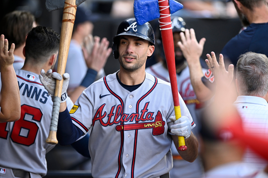 Atlanta Braves' Matt Olson celebrates with teammates in the dugout after hitting a two-run home run during the first inning of a baseball game against the Chicago White Sox in Chicago, Tuesday, June 9, 2026. (AP Photo/Paul Beaty)