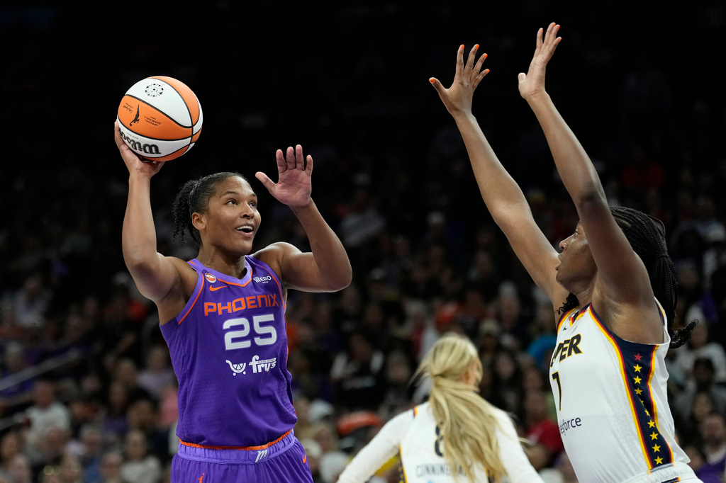 Phoenix Mercury forward Alyssa Thomas (25) shoots over Indiana Fever center Aliyah Boston (7) during the second half of a WNBA basketball game, Thursday, July 9, 2026, in Phoenix. (AP Photo/Ross D. Franklin)