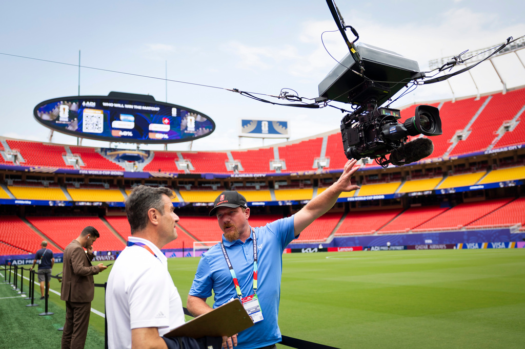 Broadcast staff worker prepare the overhead spider camera at Kansas City Stadium ahead of the World Cup quarterfinal match between Argentina and Switzerland, Friday, July 10, 2026 in Kansas City, Mo. (Peter Klaunzer/Keystone via AP)