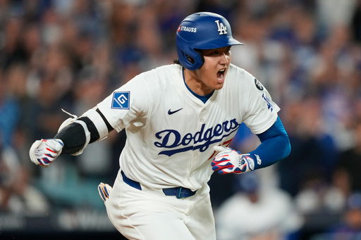 Los Angeles Dodgers' Shohei Ohtani reacts as he drives in a run with a single during the sixth inning in Game 2 of the National League Wild Card baseball playoff series against the Cincinnati Reds, Wednesday, Oct. 1, 2025, in Los Angeles. (AP Photo/Mark J. Terrill) Los Angeles Dodgers' Shohei Ohtani reacts as he drives in a run with a single during the sixth inning in Game 2 of the National League Wild Card baseball playoff series against the Cincinnati Reds, Wednesday, Oct. 1, 2025, in Los Angeles. (AP Photo/Mark J. Terrill)