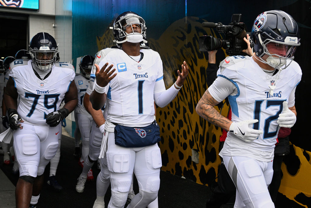 Tennessee Titans quarterback Cam Ward (1) walks out of the tunnel on to the field before an NFL football game against the Jacksonville Jaguars, Sunday, Jan. 4, 2026, in Jacksonville, Fla. (AP Photo/Phelan M. Ebenhack)