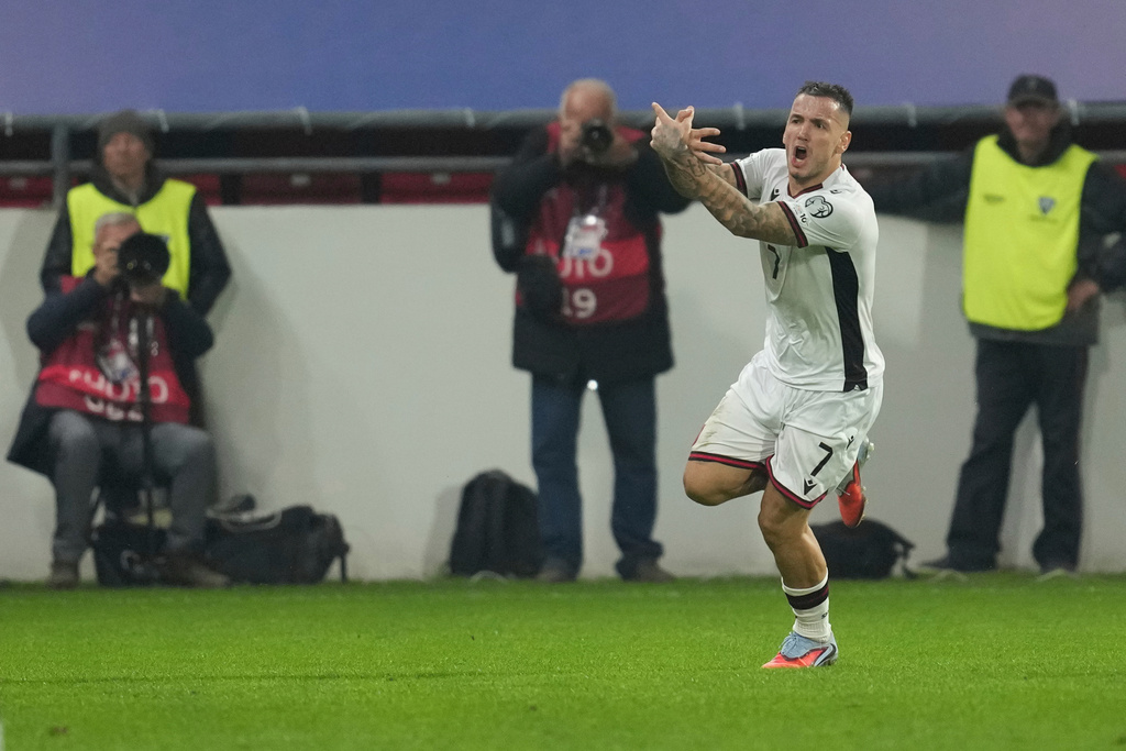 Albania's Rey Manaj celebrates after scoring his side's opening goal during the World Cup Group K qualifying soccer match between Serbia and Albania, at the Dubocica Stadium in Leskovac, Serbia, Saturday, Oct. 11, 2025. (AP Photo/Darko Vojinovic)