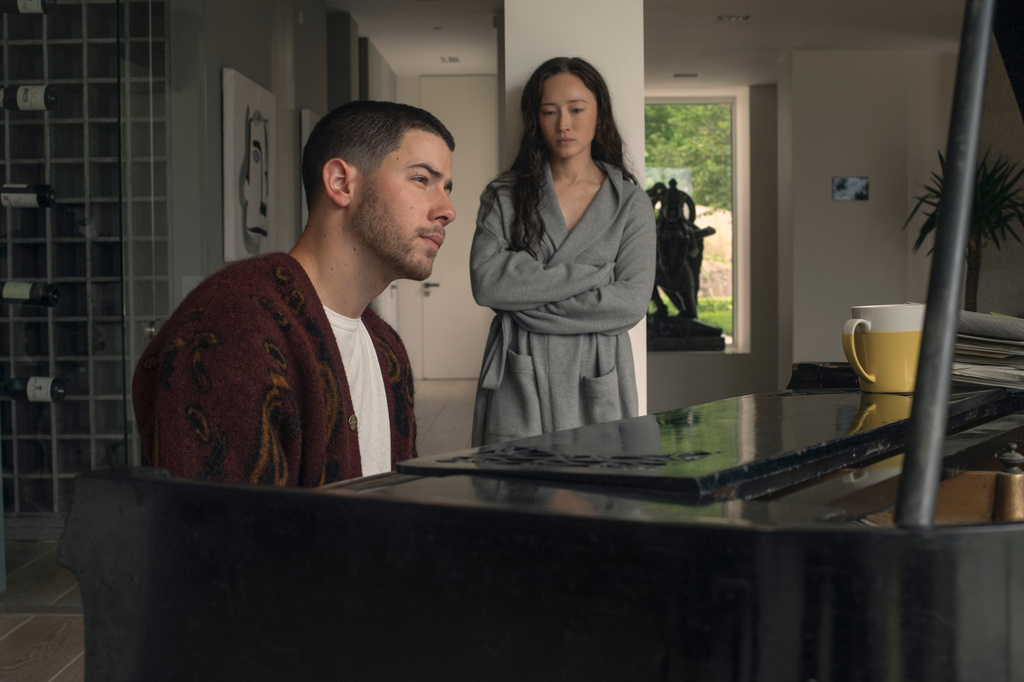This image released by Lionsgate shows Nick Jonas, left, and Havana Rose Liu in a scene from "Power Ballad." (David Cleary/Lionsgate via AP)