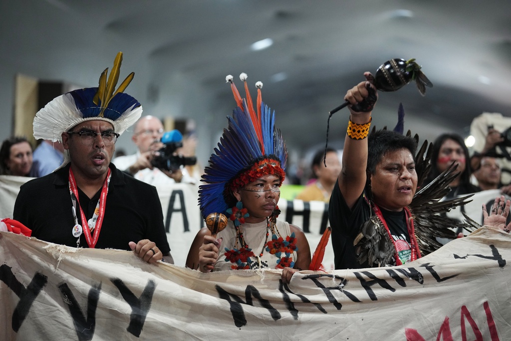 Indigenous activists participate in a protest at the COP30 U.N. Climate Summit, Friday, Nov. 21, 2025, in Belem, Brazil. (AP Photo/Andre Penner)