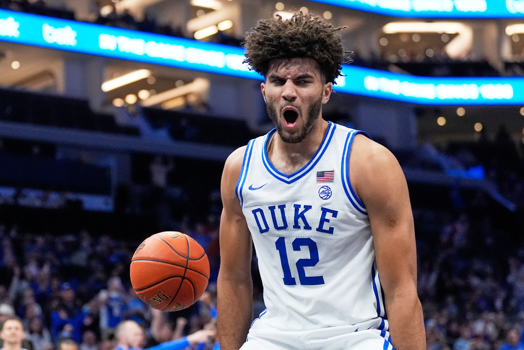 Duke forward Cameron Boozer celebrates after scoring against Texas during the second half of an NCAA college basketball game, Tuesday, Nov. 4, 2025, in Charlotte, N.C. (AP Photo/Chris Carlson)