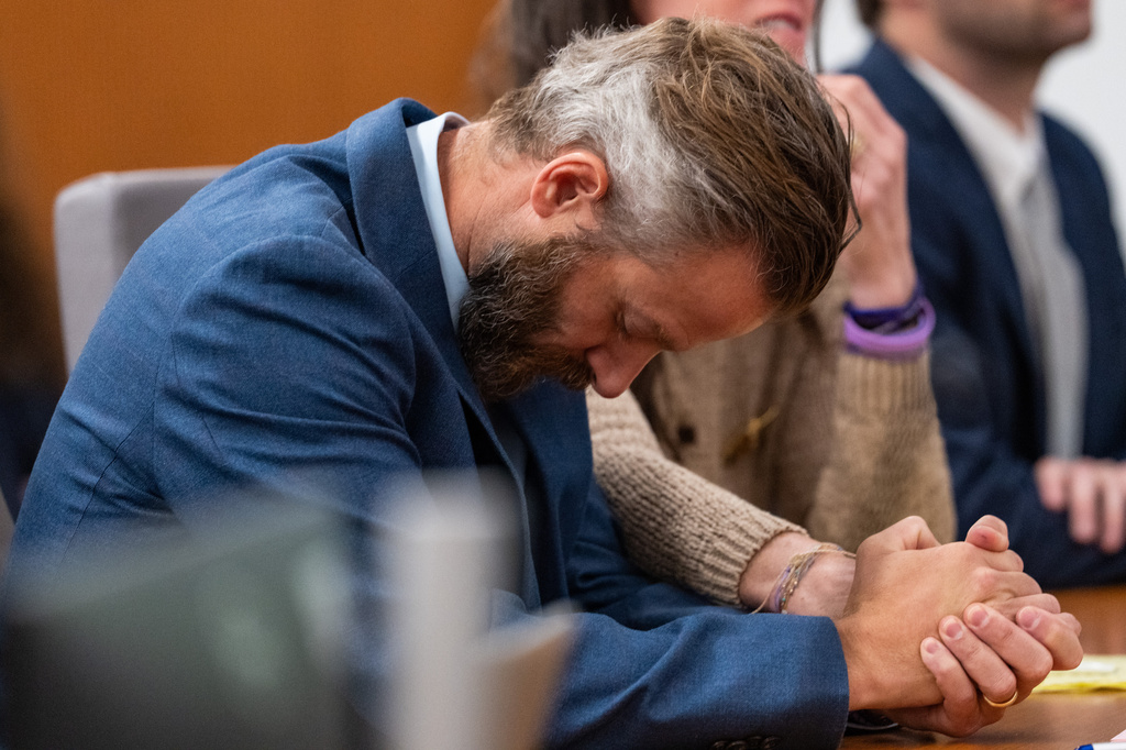 Will Steward, who lost his 8-year-old daughter Cile Steward in the July 4 flood, hangs his head as he listens to testimony during a hearing on a suit against Camp Mystic in the 459th State District Court in Austin, Wednesday, April 15, 2026. (Mikala Compton/Austin American-Statesman via AP)