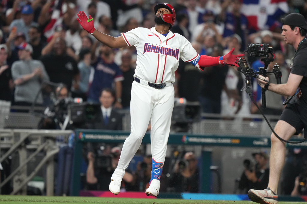 Dominican Republic's Junior Caminero looks up after hitting a home run during the second inning of a World Baseball Classic semifinal game against the United States, Sunday, March 15, 2026, in Miami. (AP Photo/Lynne Sladky)