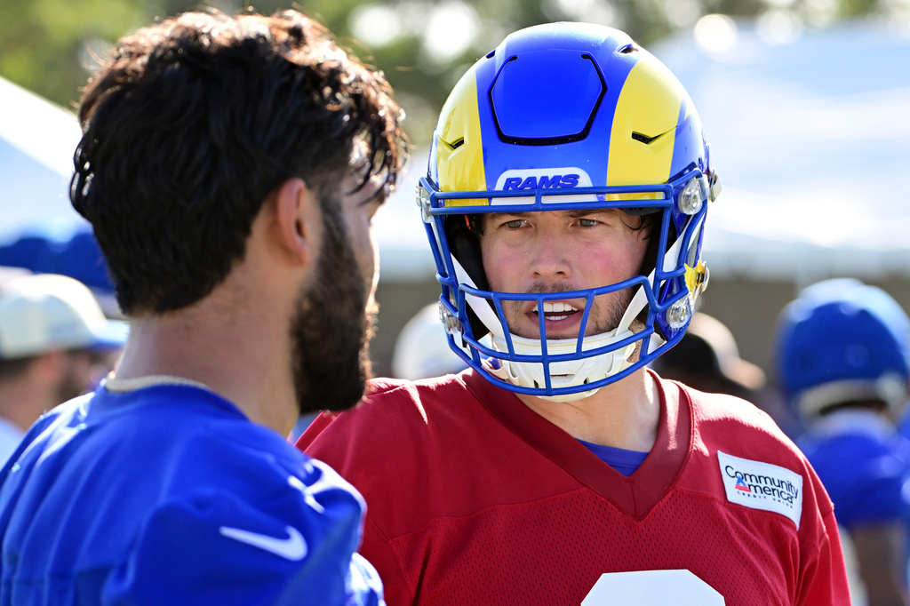 Rams quarterback Matthew Stafford, right, talks with wide receiver Puca Nacua, left, during an NFL football training camp Monday, July 27, 2026, in Los Angeles. (AP Photo/Wally Skalij)