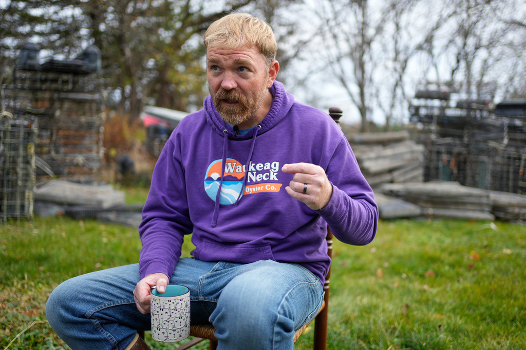 Graham Platner, Democratic candidate for U.S. Senate, speaks to a reporter at his home, Monday, Nov. 3, 2025, in Sullivan, Maine. (AP Photo/Robert F. Bukaty)