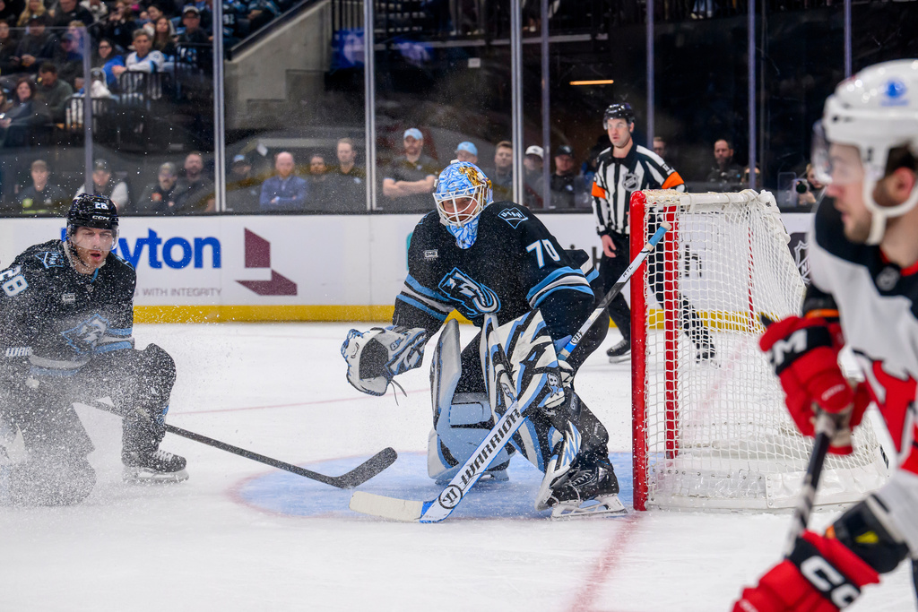 Utah Mammoth goaltender Karel Vejmelka (70) protects the net during the second period of an NHL hockey game against the New Jersey Devils, Friday, Dec. 19, 2025, in Salt Lake City. (AP Photo/Tyler Tate)