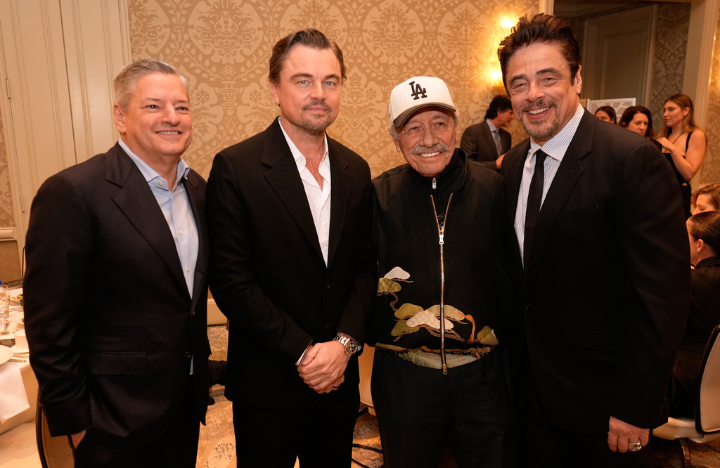 Netflix CEO Ted Sarandos from left, and actors Leonardo DiCaprio, Edward James Olmos and Benicio del Toro pose for a photo at the AFI Awards at the Four Seasons in Los Angeles, Friday, Jan. 9, 2026. (AP Photo/Chris Pizzello)