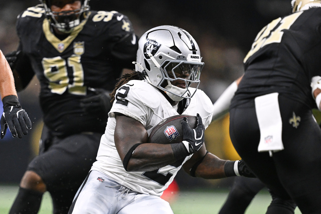 Las Vegas Raiders running back Ashton Jeanty (2) runs the ball during the first half of an NFL football game against the New Orleans Saints in New Orleans, Sunday, Sept. 27, 2026. (AP Photo/Ella Hall)