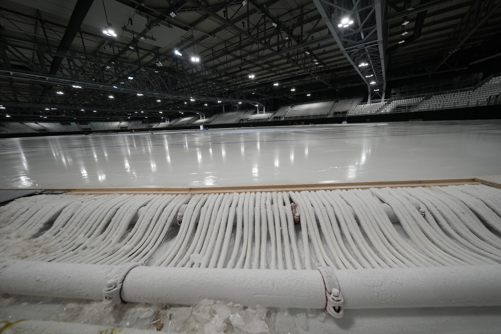 Serpentines are set on the ice of the stadium where speed skating discipline of the Milan Cortina 2026 Winter Olympics will take place, in Rho, outskirt of Milan, Tuesday, Nov. 11, 2025. (AP Photo/Luca Bruno)