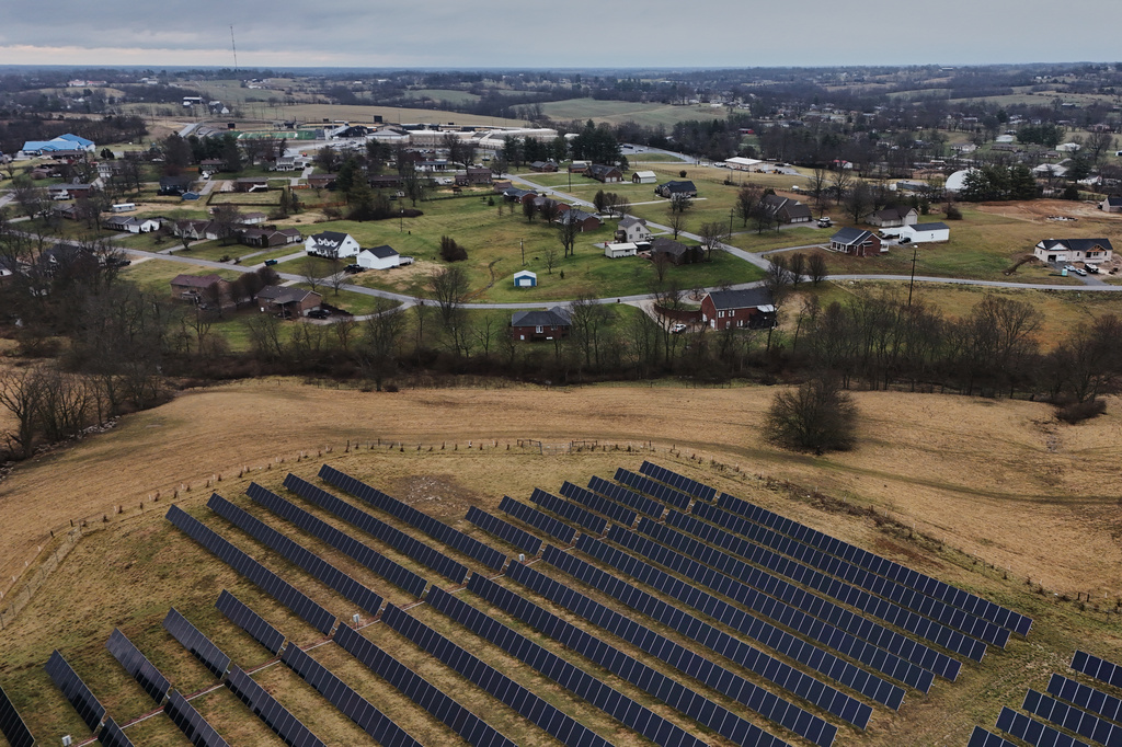 Solar panels operate on a farm near homes Wednesday, Jan. 14, 2026, in Lancaster, Ky. (AP Photo/Joshua A. Bickel)