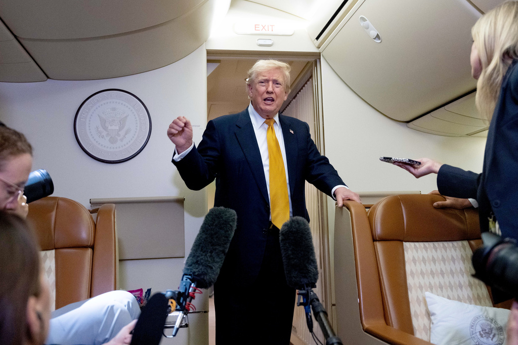 FILE - President Donald Trump speaks with reporters in flight on Air Force One after landing at U.S. Air Force Base at RAF Mildenhall, in Suffolk Eastern England, July 8, 2026. (AP Photo/Alex Brandon, File)
