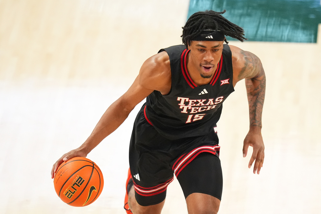 Texas Tech forward JT Toppin drives to the basket against Baylor during the first half of an NCAA college basketball game Tuesday, Jan. 20, 2026, in Waco, Texas. (AP Photo/Julio Cortez)